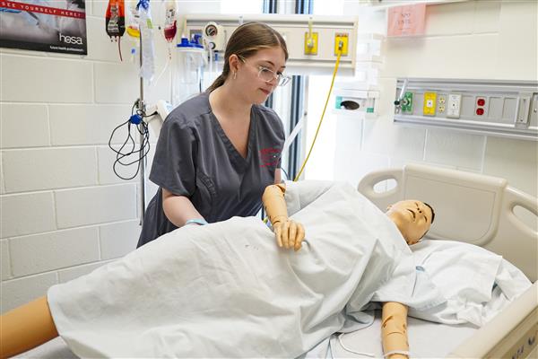 MEDICAL & HEALTH PROFESSIONS students working in lab